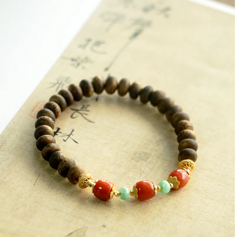 沉香莺歌绿奇楠沉香算盘珠配南红单圈手串