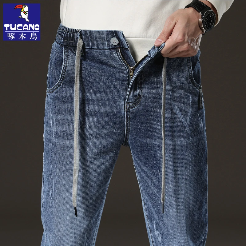 啄木鸟2025春秋季新款抽绳松紧腰男士牛仔裤春秋款修身直筒休闲裤