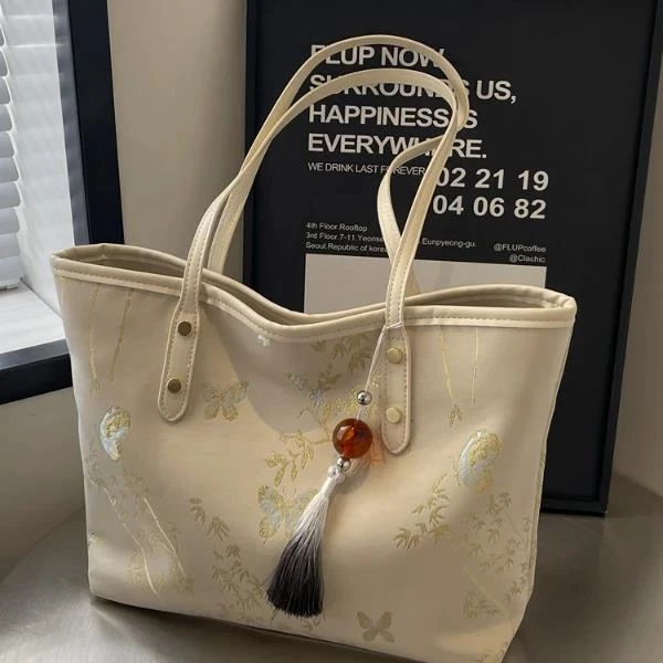 新中式国风托特包女2025新款夏时尚刺绣帆布单肩包休闲上班通勤包