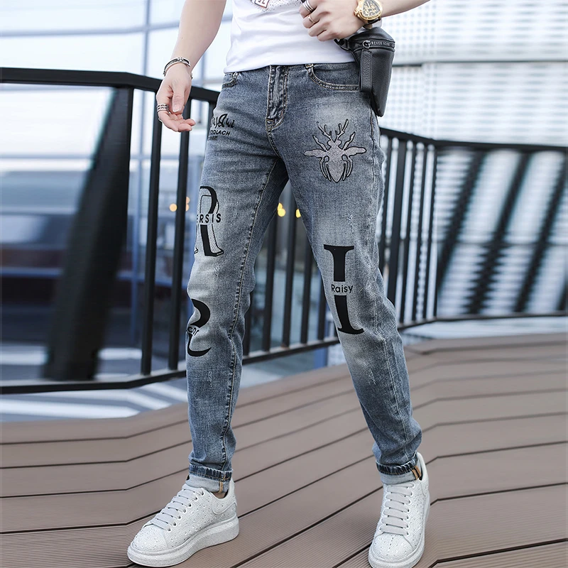 欧洲站男士休闲裤男款潮流个性烫钻高端时尚男修身小脚牛仔长裤子