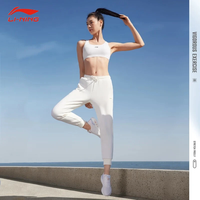 李宁春季健身系列卫裤宽松针织束脚休闲时尚运动长裤女款AKLT538