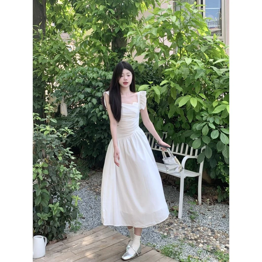 夏季新款法式小心机镂空白色连衣裙收腰显瘦飞飞袖长款约会初恋裙