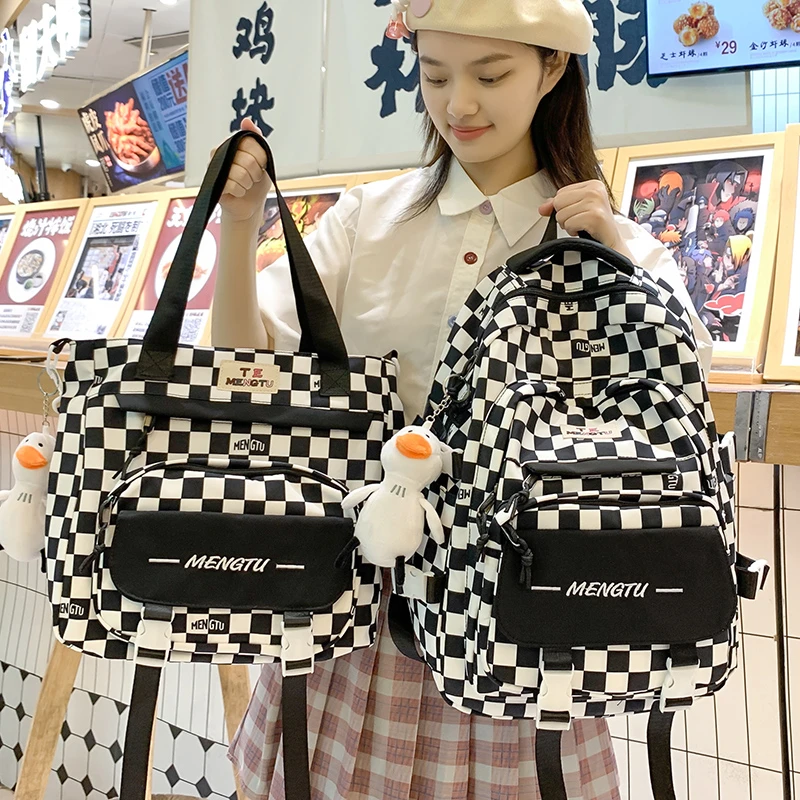 大容量书包女生小学生三到六年级多层双肩包高中生初中生轻便背包