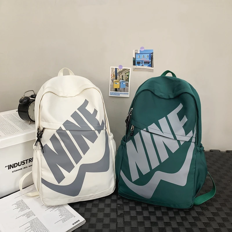 学生书包女休闲防水背包初中男大百搭容量电脑包双肩包旅行背包