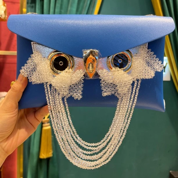 WANACCESSORY新款绿色蓝色双面换脸包英国设计师品牌