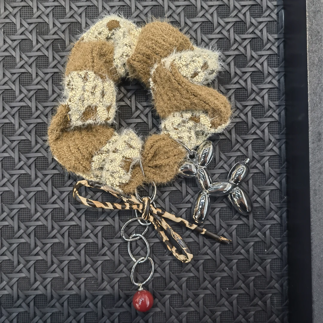 B180豹纹蝴蝶结气球狗咖色拼色肠圈