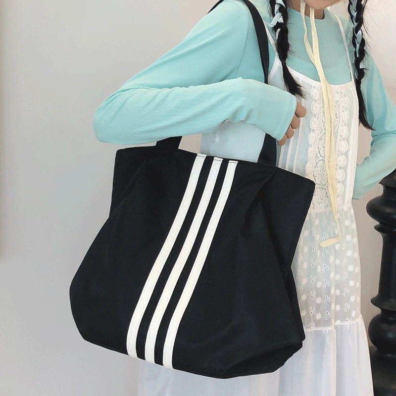 简约时尚大容量托特包女休闲百搭学生邮差逛街手提袋轻便收纳单肩