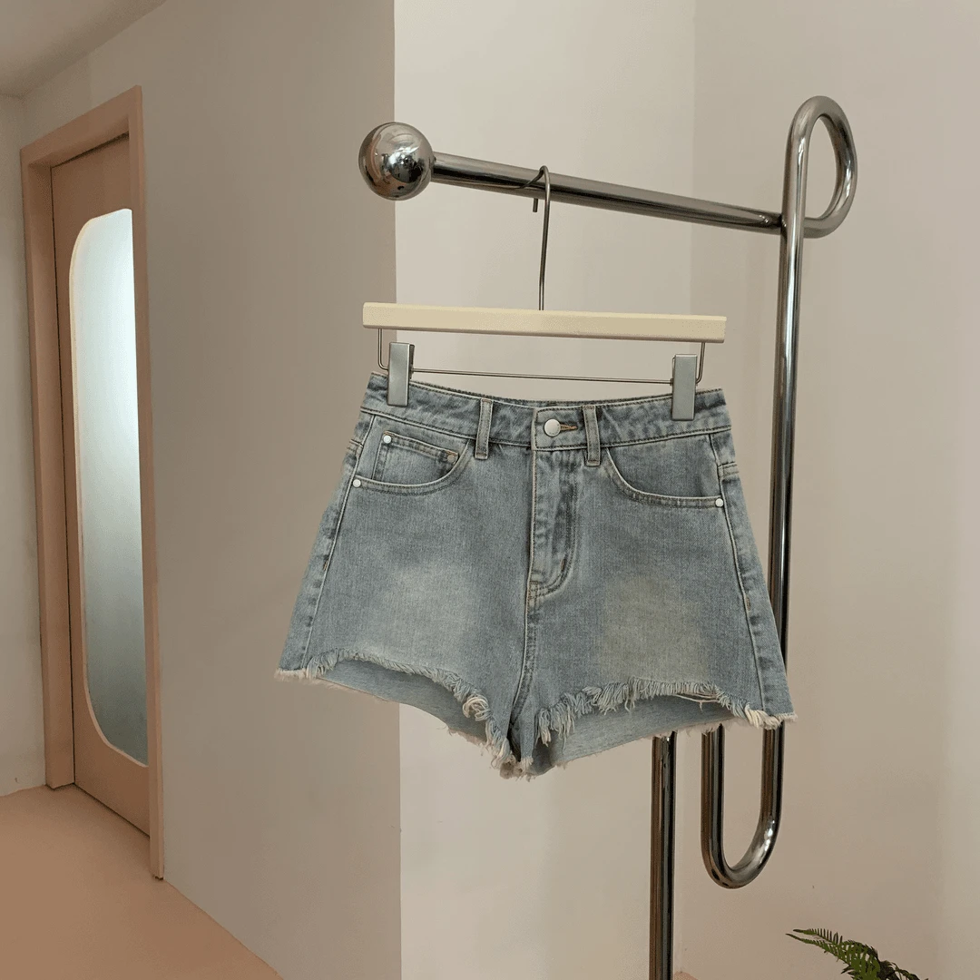 【塔鹿蕾】设计师复古显瘦时尚设计感水洗磨毛边牛仔短裤7705