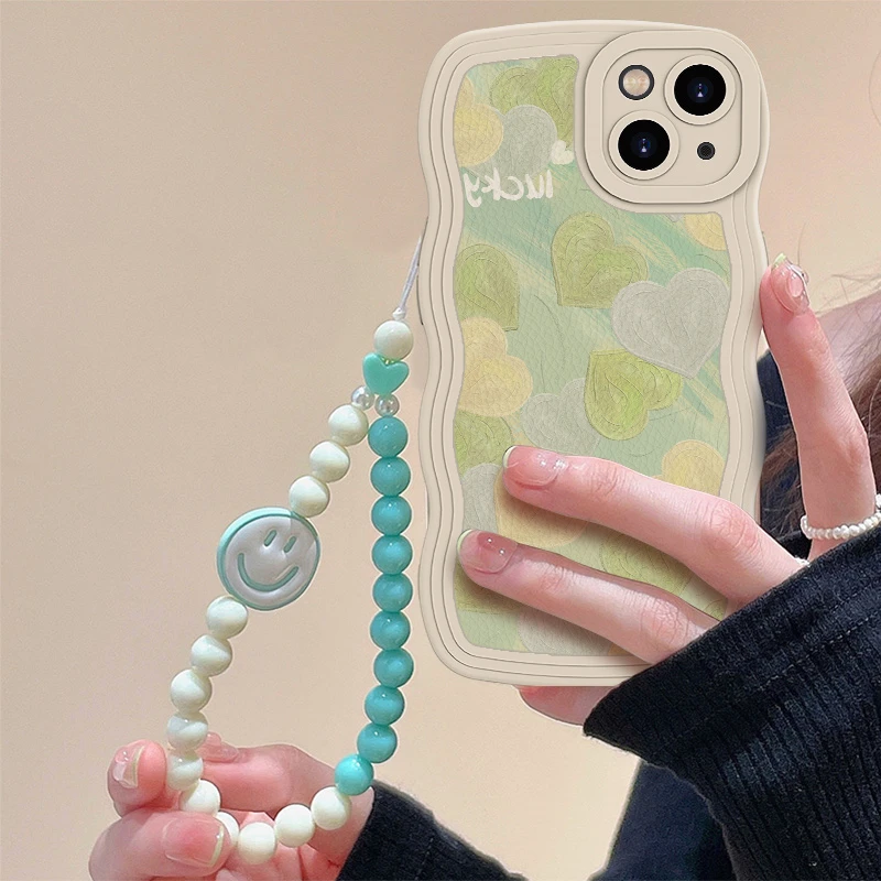 ins风波浪边淡绿爱心适用苹果15/14手链新款高级感全包防摔手机壳