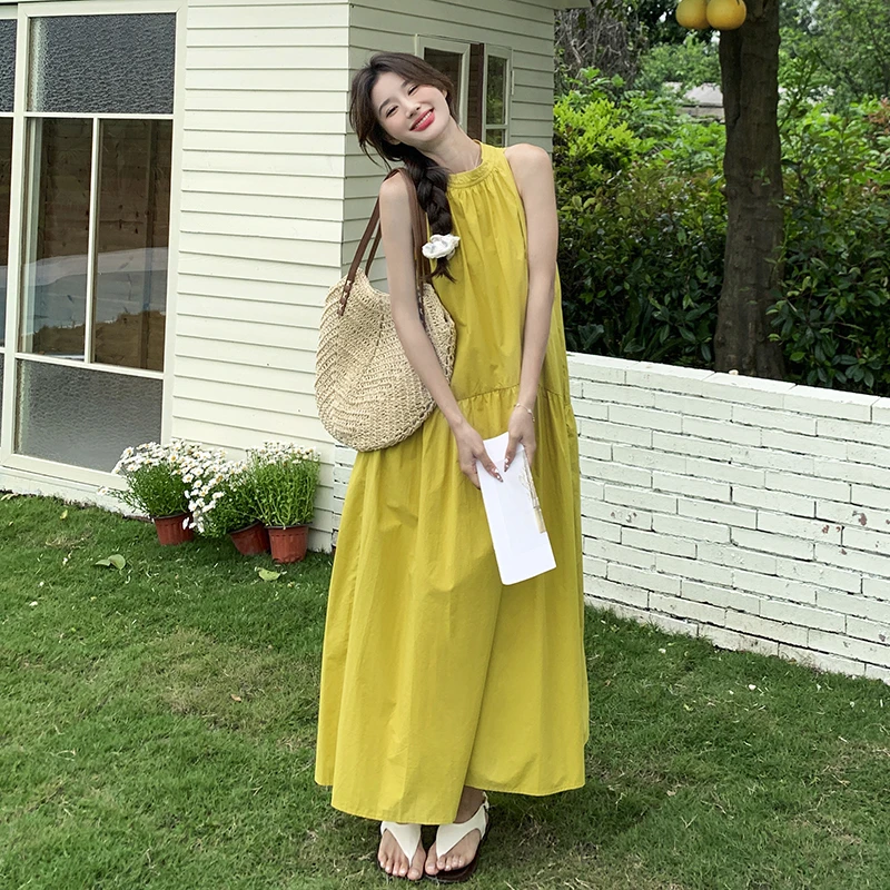 黄色无袖挂脖连衣裙夏季女2024新款度假风宽松气质复古长款A字裙