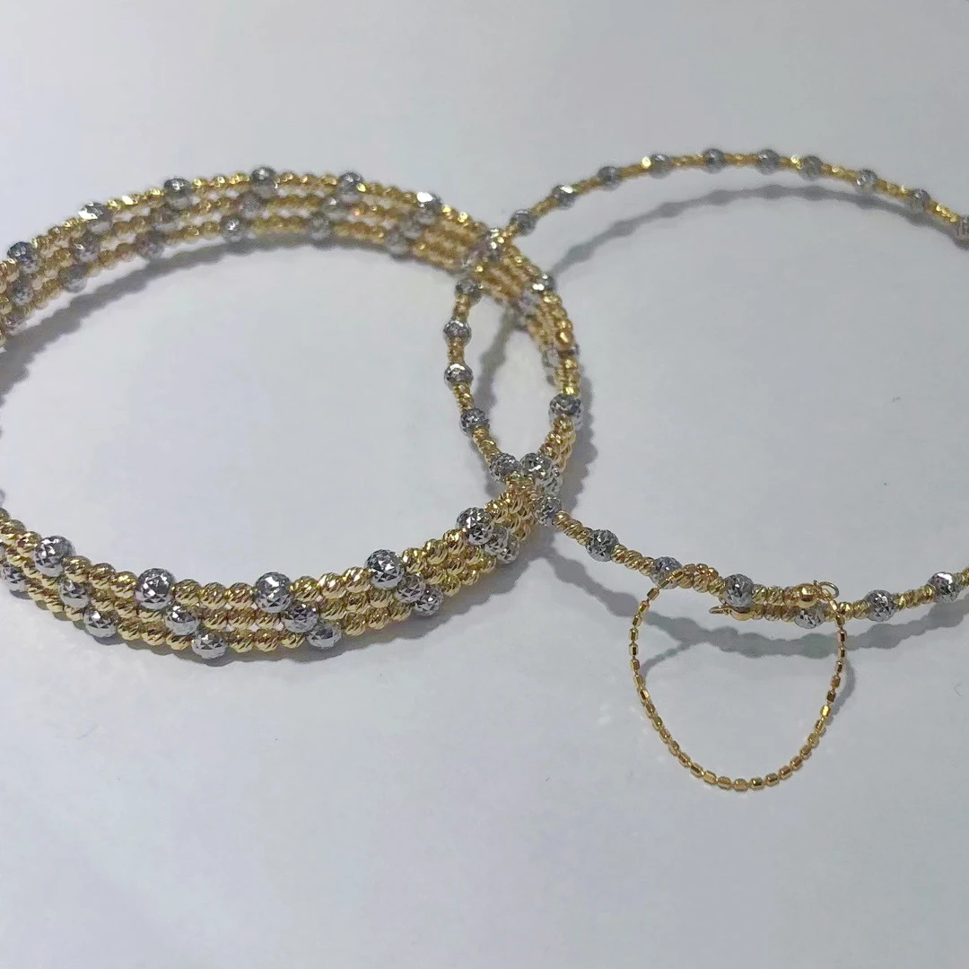 18k黄白双色爆闪记忆手镯璀璨星河进口记忆弹力手镯 克重多退少补