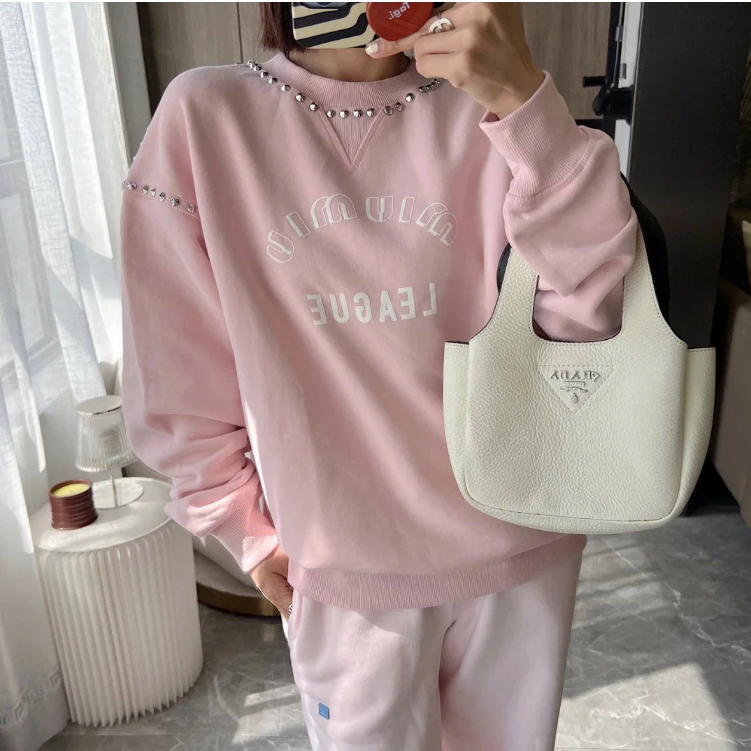 99新Miu Miu 缪缪女士成衣染色铆钉装饰卫衣  XS码 00258