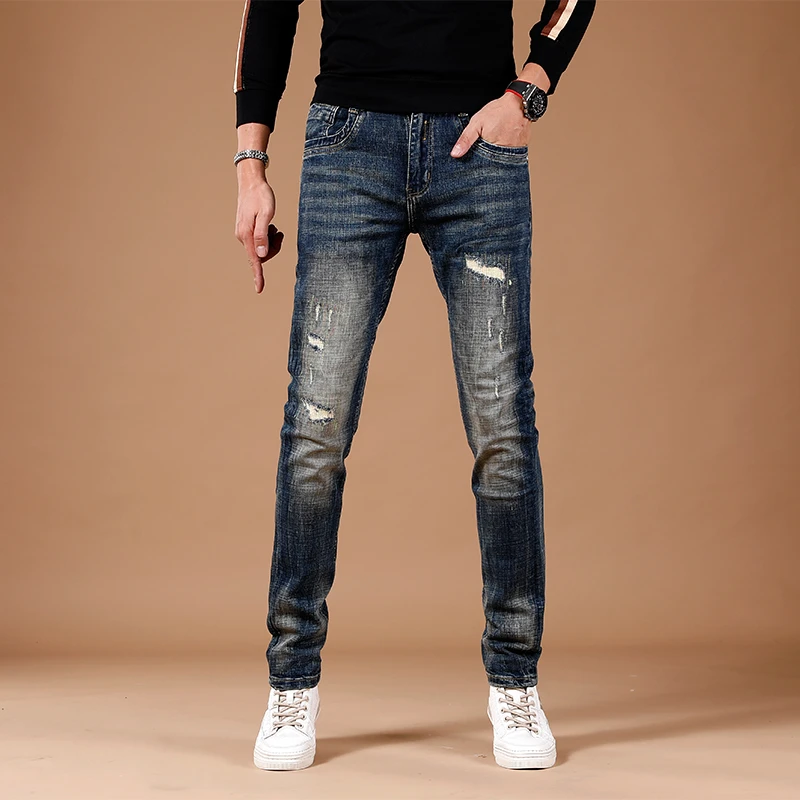 秋季新款深蓝色水洗复古高端牛仔裤破洞补丁修身小脚潮流休闲长裤