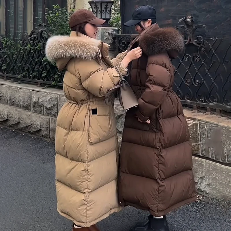 真毛领加长款过膝加厚情侣款羽绒服女2025新款连帽白鸭绒收腰外套