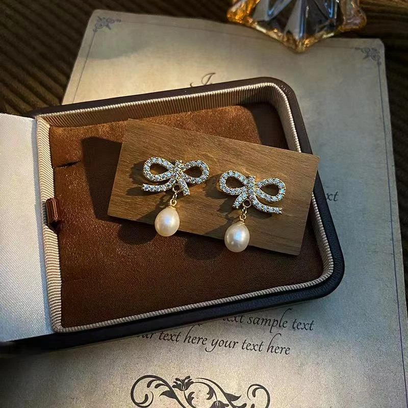 冬季新品设计感精致满钻蝴蝶结珍珠耳环女气质轻奢时尚耳饰耳钉