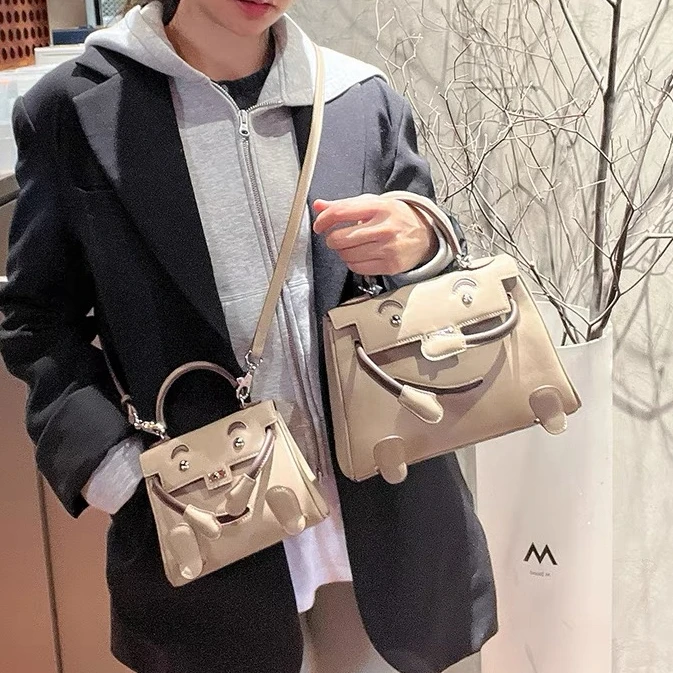 CTANDJIM头层牛皮精钢五金银扣本色线玩具包 小手提