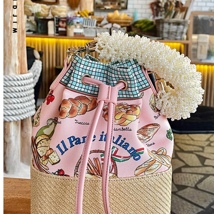 CTANDJIM夏日度假野餐珍珠手腕手提百搭休闲小众抽绳篮子包福袋包