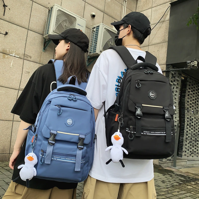 减负护脊高颜值书包女学生百搭双肩包四五六年级初中生男帅气背包