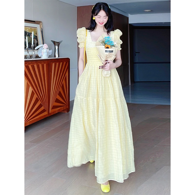 TRACYCHU欧若风质显瘦法式收腰鹅黄色小千谷缩丝棉大摆女神连衣裙