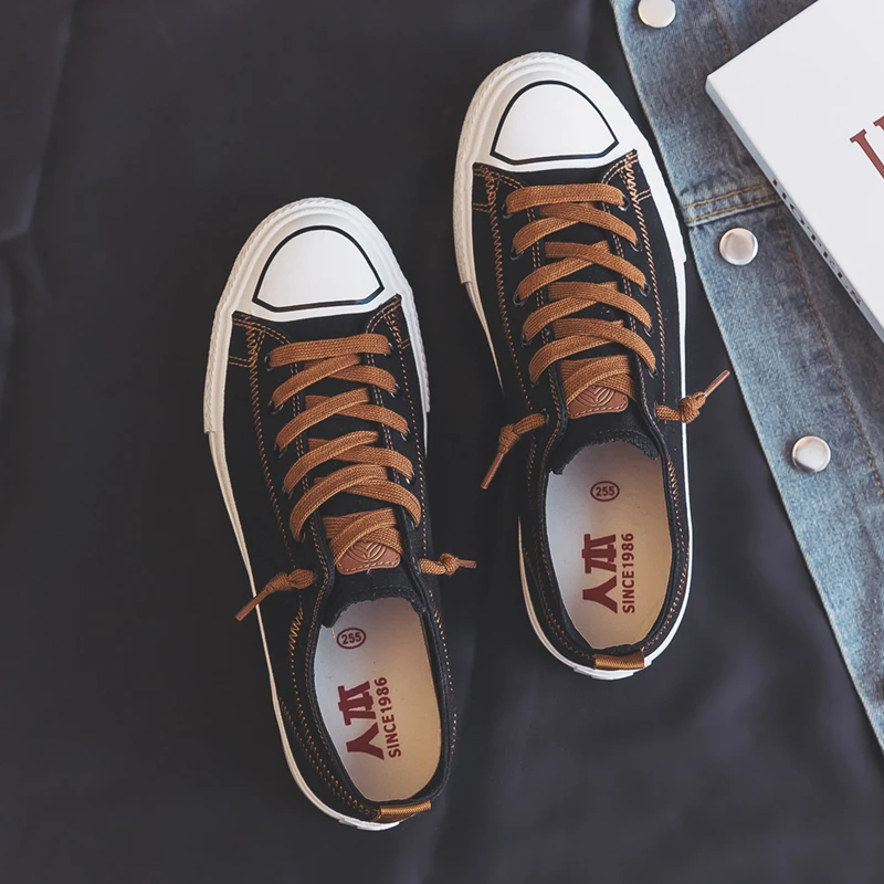 人本帆布鞋男春季2025新款男鞋休闲百搭低帮学生黑色平底板鞋子