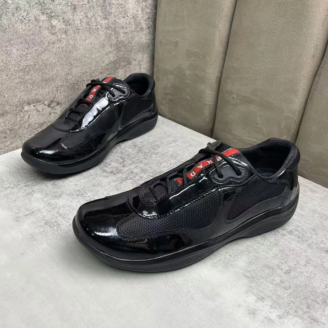 99新 Prada/普拉达 黑色漆皮网面舒适时尚百搭休闲运动鞋 38码