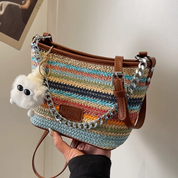 彩虹编织包包女式2024新款夏天流行斜挎包海边度假草编手提水桶包