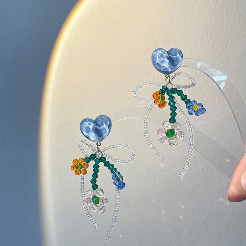 海盐橘子网红蓝色串珠水晶花朵耳环显脸小蝴蝶结女年新款