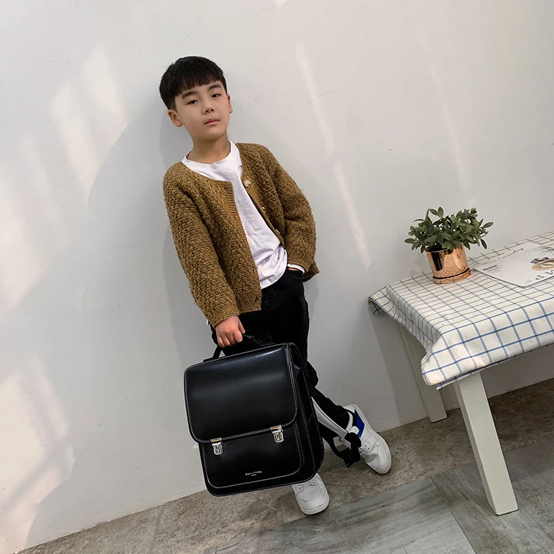 英伦小学生书包减负护脊超轻防水简约时尚