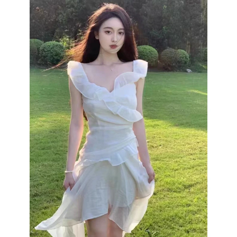 2024新款夏季海边度假裙子荷叶边白色不规则吊带露背连衣裙小众女