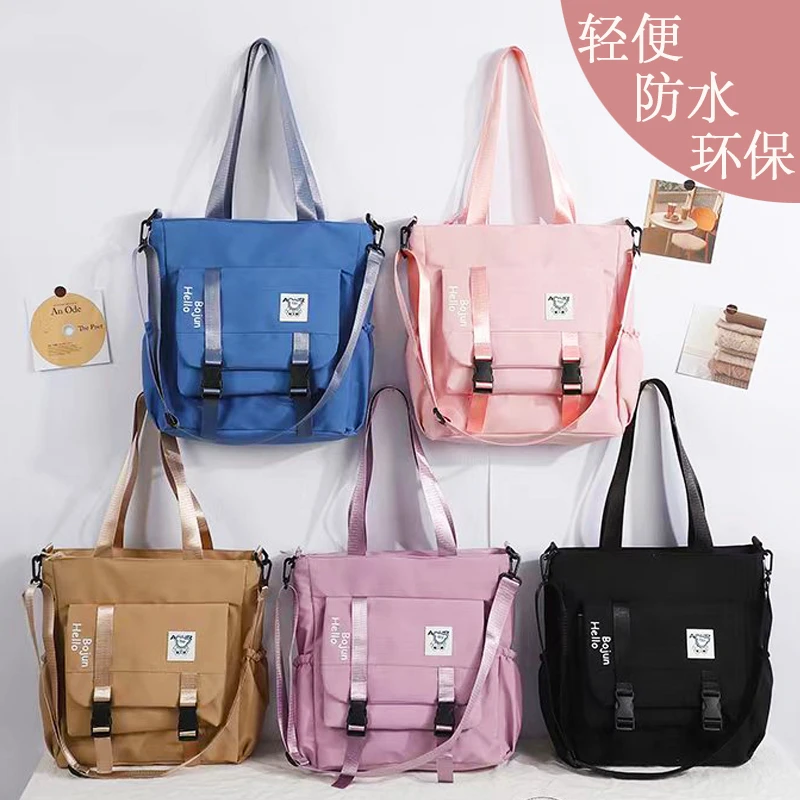 学生斜挎包轻便防水简约女孩大容量初中生手提补习袋补课包男单肩