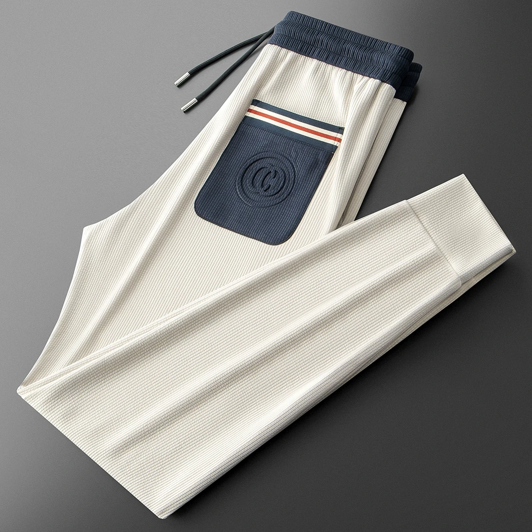 夏季垂顺柔软冰丝莫代尔时尚潮流撞色拼接男士运动小脚卫裤休闲裤