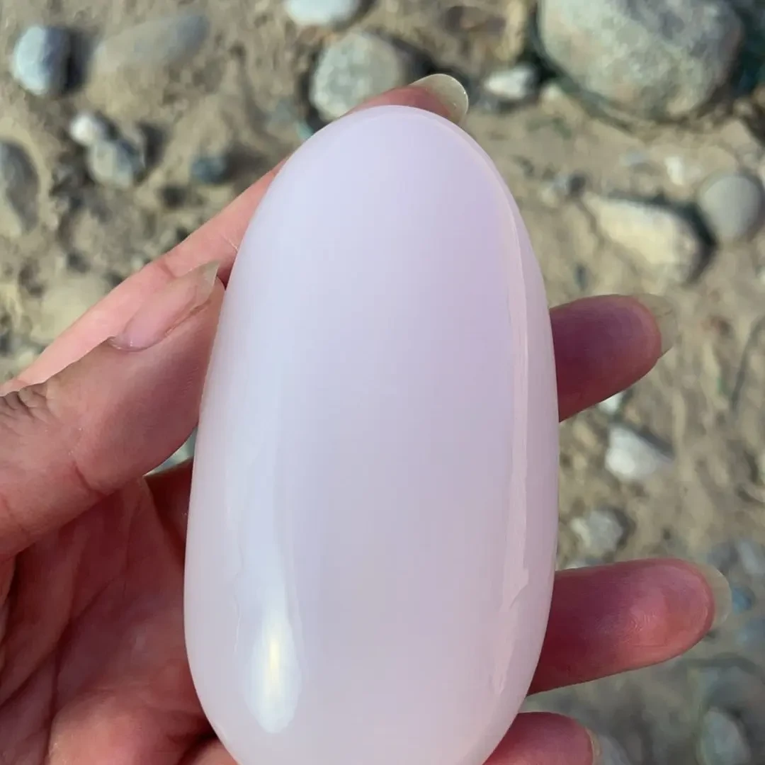 天然新缰桃花粉手把件