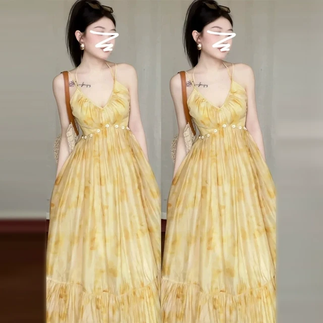 法式气质黄色吊带碎花连衣裙子女装夏季2024新款海边度假绝美长裙