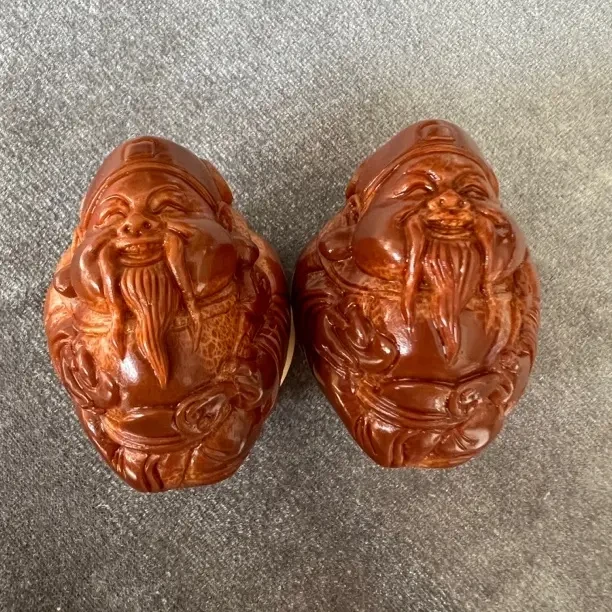 橄榄核雕刻财神手球精品文玩手把件