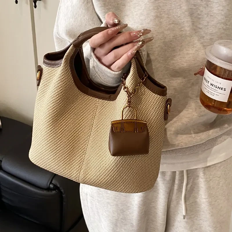 今年流行复古时尚手提菜篮子包包女2025新款春夏季通勤单肩斜挎包