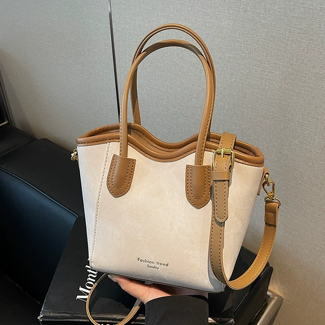 简约洋气撞色手提水桶包包女式2025新款百搭时尚通勤斜挎包小拎包