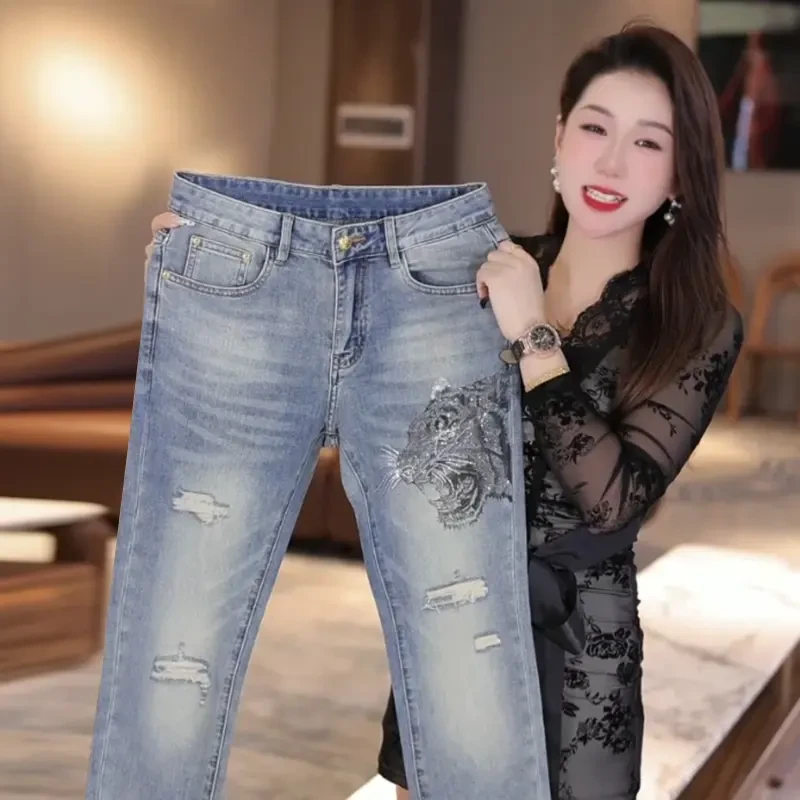 夏季薄款新款破洞牛仔裤男烫钻工艺时尚百搭修身弹力裤子显高显瘦