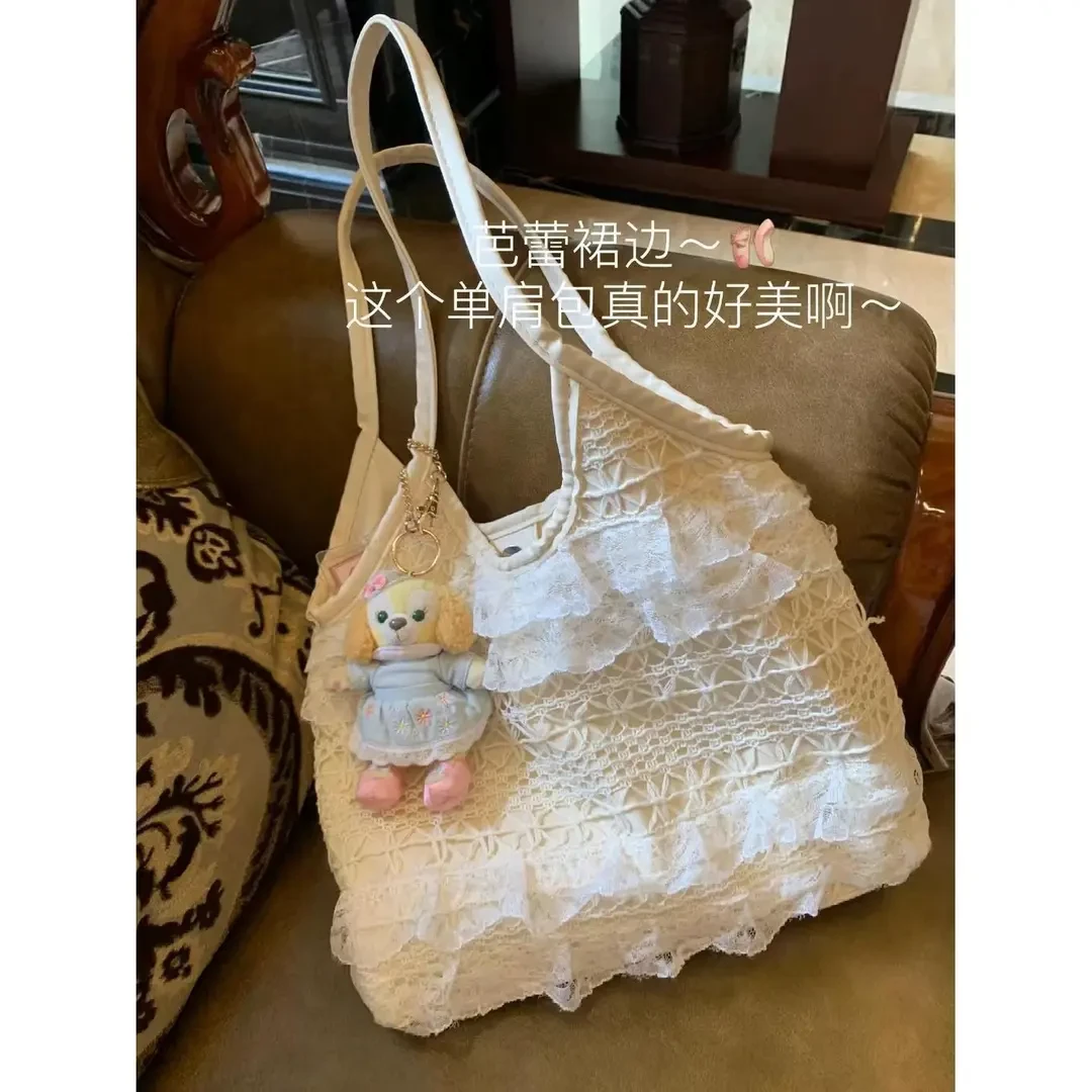 2025新款夏季休闲度假仙气蕾丝网纱单肩包简约大容量通勤腋下kmt