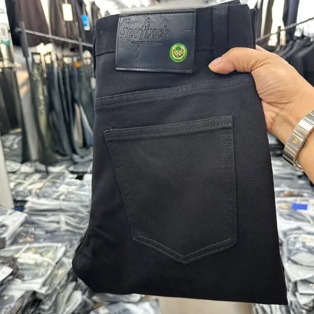 M K 901秋冬新款男士纯黑色港风简约时尚修身弹力防褪色牛仔裤