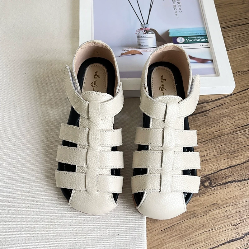 森系真皮包头凉鞋女2024年夏季新款镂空平底猪笼鞋牛皮罗马凉鞋女