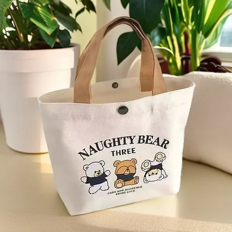 【新人福利】手提包包女时尚新款小熊帆布包上班饭盒手提袋大容量托