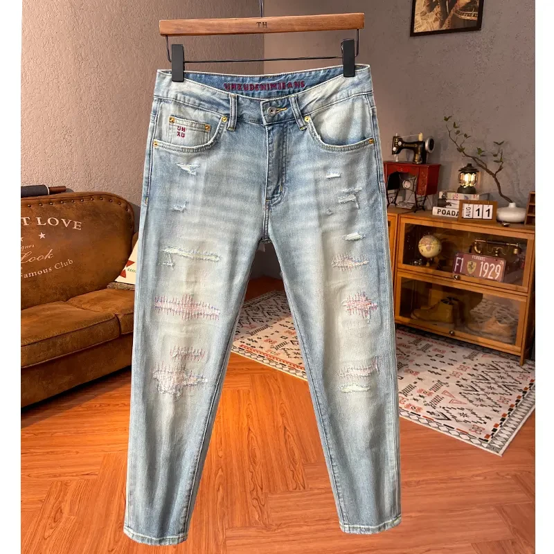 夏季高端浅蓝破洞牛仔裤男潮牌机车风修身小脚补丁痞帅显瘦九分裤
