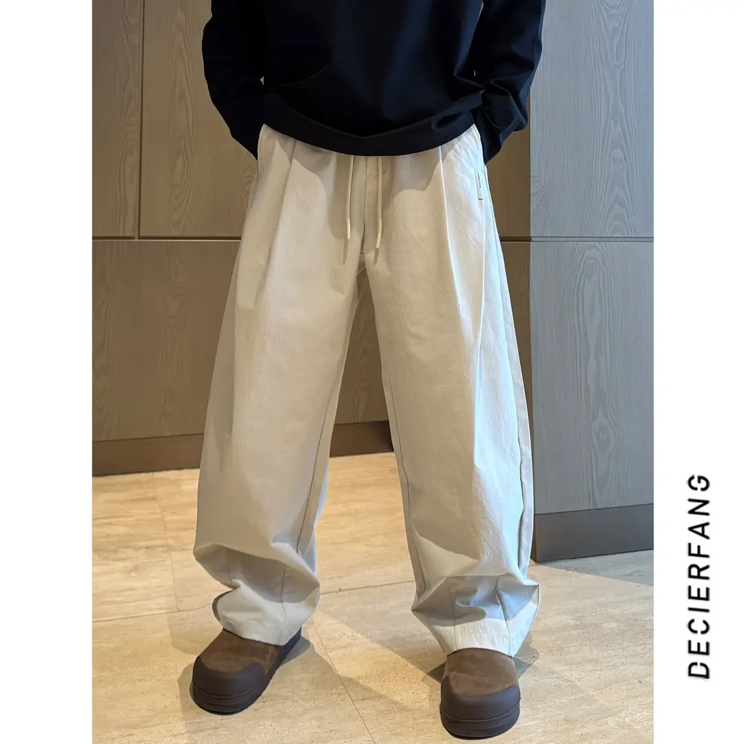 早春美式打褶弯刀裤潮牌简约百搭高级感直筒宽松休闲裤长裤裤子