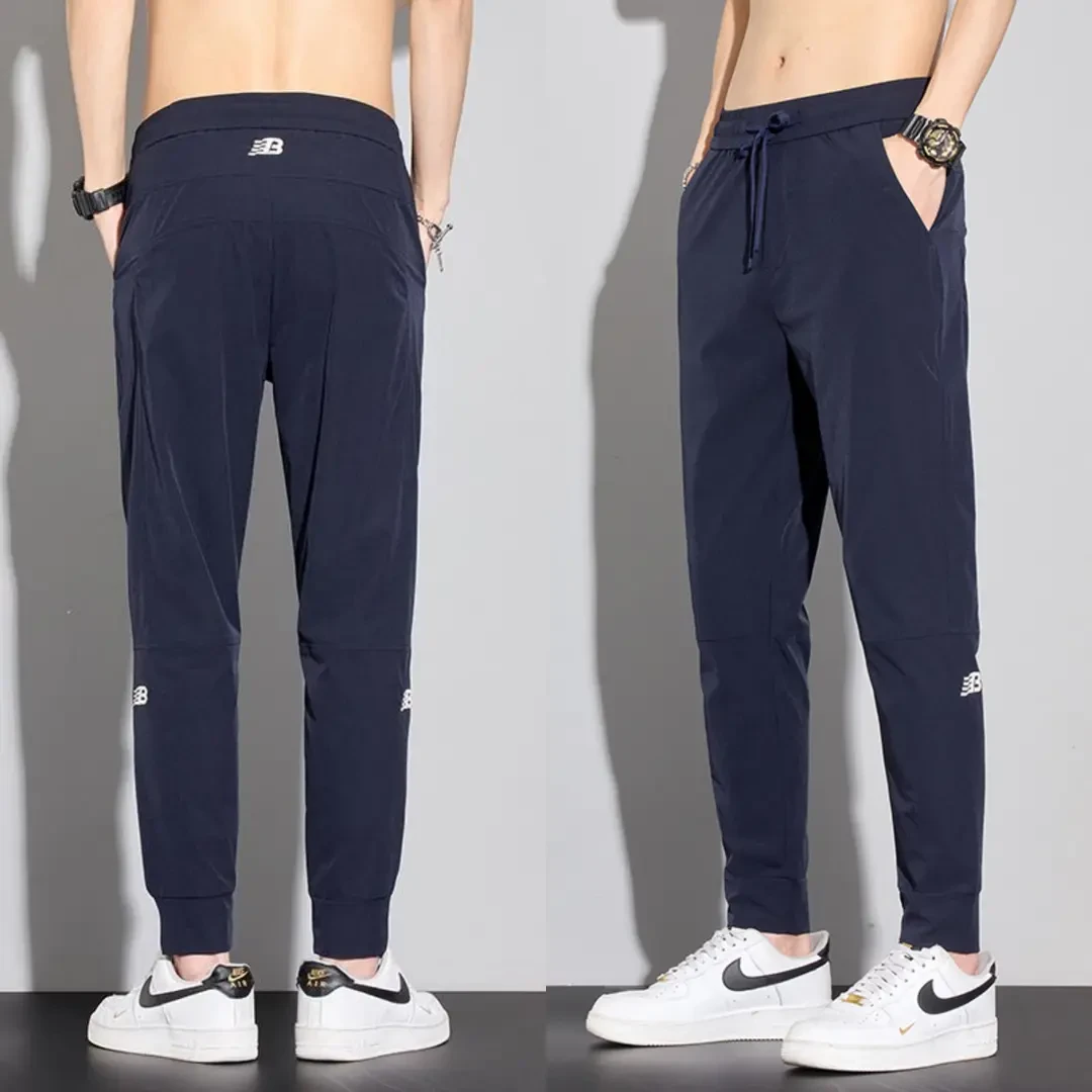 啄木鸟夏季薄款冰丝男士休闲裤九分束脚裤潮流时尚百搭弹力男裤子