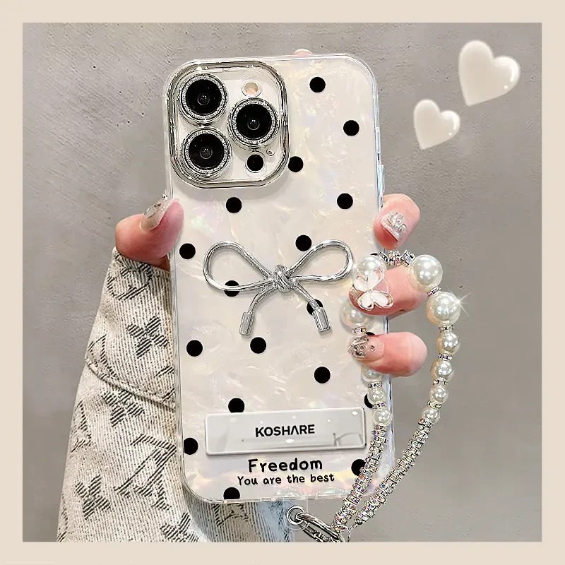 适用波点蝴蝶结于苹果16promax贝壳纹支架手机壳iPhone15/14pro