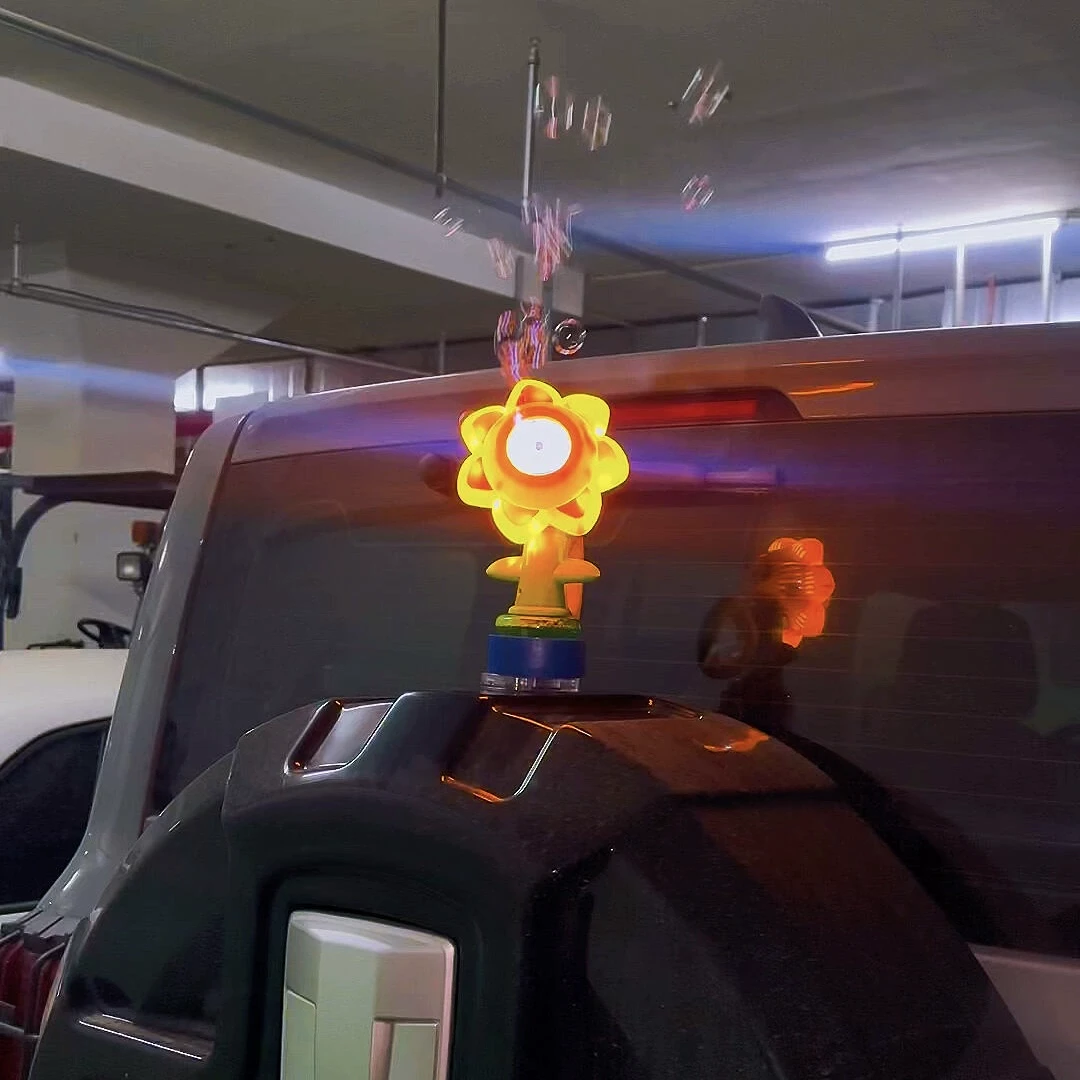 七色太阳花泡泡机汽车电动车尾部摇头晃脑小摆件向日葵遥控泡泡机