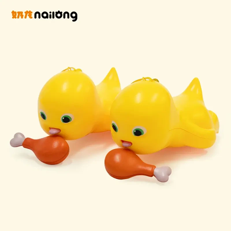 萌趣奶龙吃鸡腿拉线玩具钥匙扣书包挂件玩偶公仔创意解压发条玩具