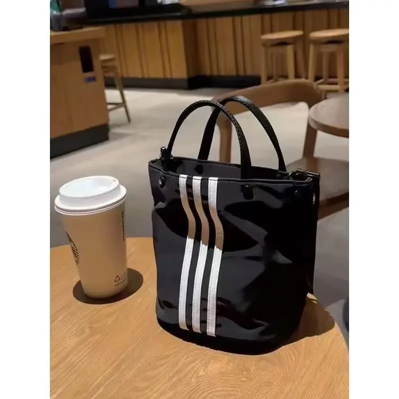 小众三条杠手提包休闲百搭水桶包新款牛津布小拎包单肩斜挎包女潮