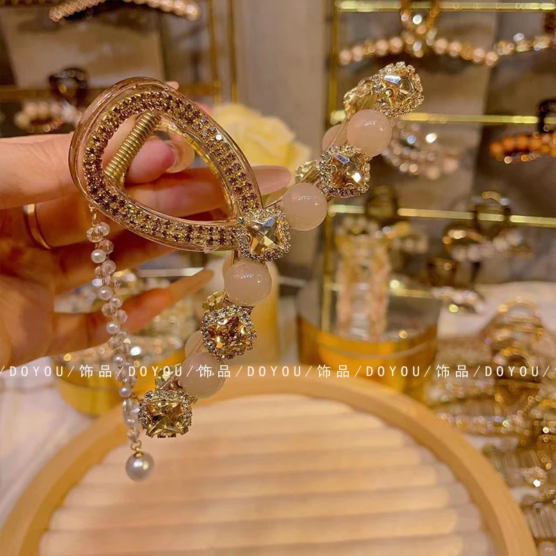 新款闪钻猫眼珠大抓夹气质轻奢精致设计感后脑勺盘发鲨鱼夹