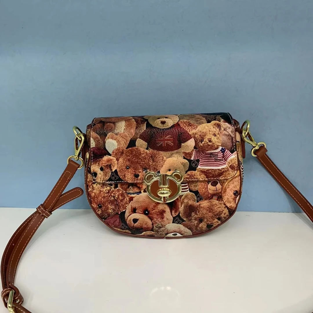 DICK BEAR/迪克熊9352新款时尚半月翻盖斜挎包